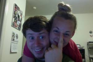 Chivalry - he is hiding the zit on her nose.